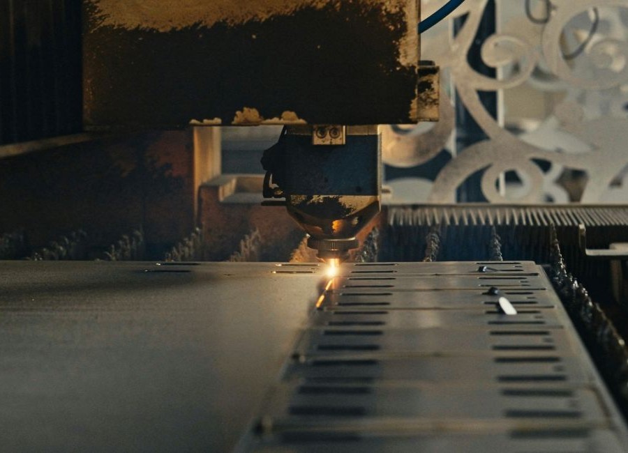 Laser cutting machine manufacturing precision metal components for advanced engineering and defence industry applications.